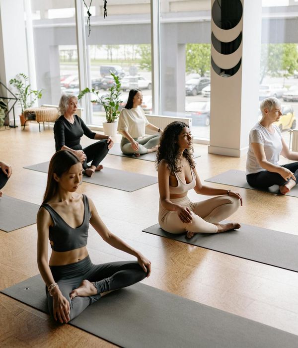 A diverse group of people enjoying a gentle yoga flow class.