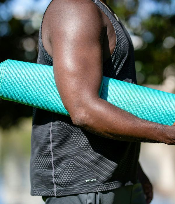 Person holding a strong yoga pose, demonstrating focus and balance.