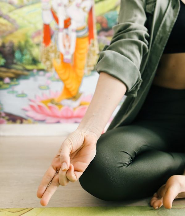 Woman in a calm yoga pose, embodying inner peace.